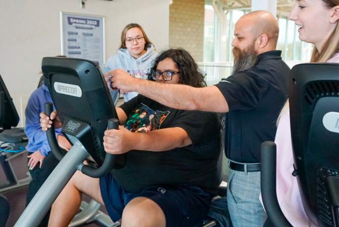 Dr. Esposito working with students and participant