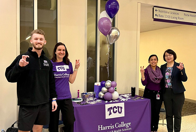 Harris College of nursing & health sciences booth table