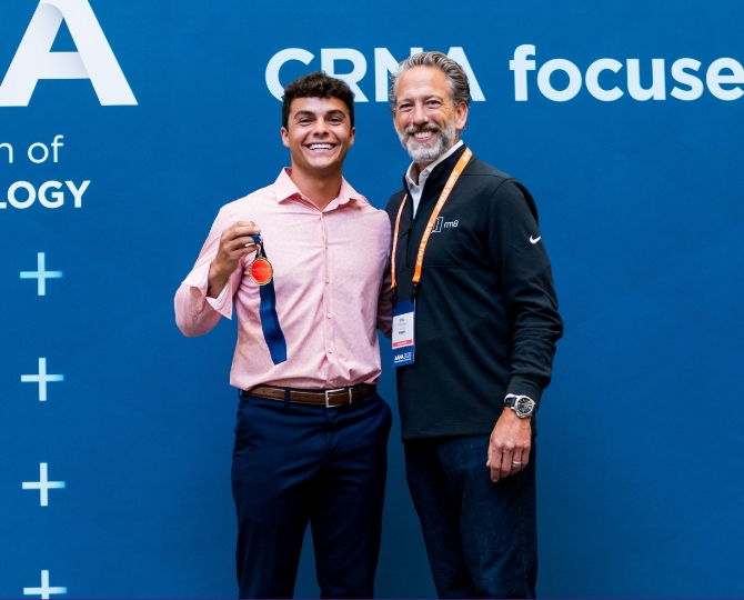 Brett Garcia, BSN, RN, RRNA, with AANA Chief Innovation Officer Eric O'Connor following his win at the Rm8 iNoV8 Pitch Competition at the AANA Annual Congress in Boston.
